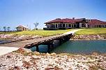 golf buggy bridge and clubhouse pelican waters.jpg